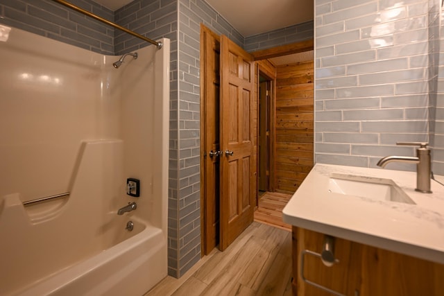 1192 Blackburn Rd, Scott Twp, WI 54801 - bathroom with wood finished floors,  shower combination, vanity, and wood walls