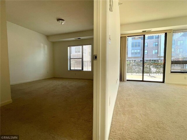 7601 Aldrich Ave S Unit 119, Richfield, MN 55423 - spare room featuring carpet floors and baseboards