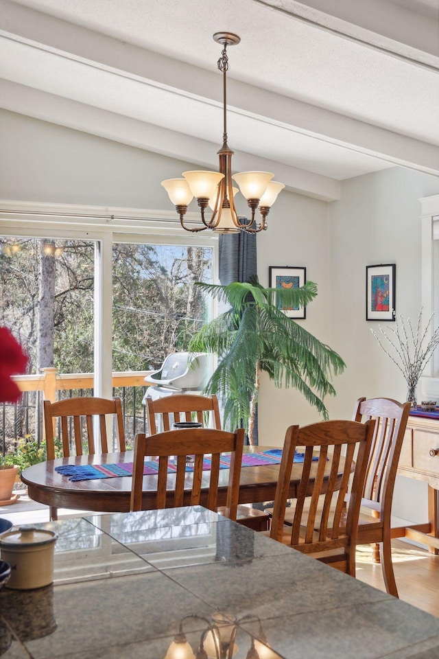 2241 17th St NW, New Brighton, MN 55112 - dining room featuring beam ceiling, a chandelier, and wood finished floors