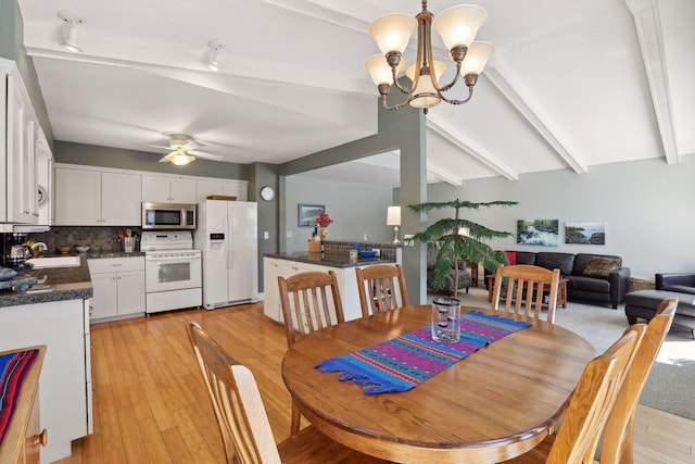 2241 17th St NW, New Brighton, MN 55112 - dining area with a chandelier, a ceiling fan, and light wood-style flooring