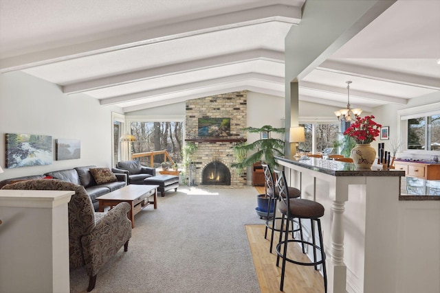 2241 17th St NW, New Brighton, MN 55112 - living room featuring a fireplace, light carpet, and a chandelier