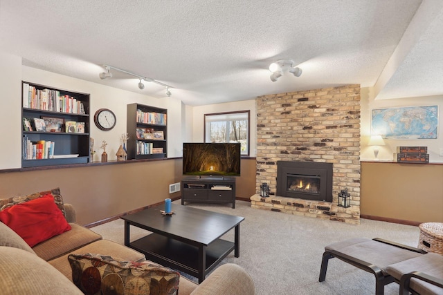 2241 17th St NW, New Brighton, MN 55112 - living area featuring carpet, a textured ceiling, a fireplace, and built in features
