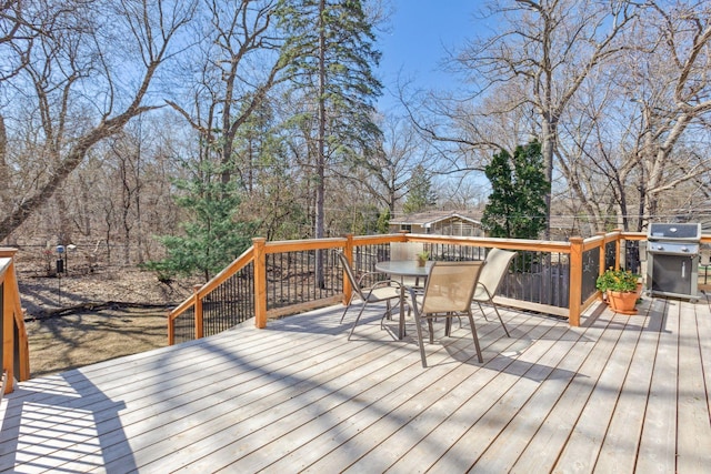 2241 17th St NW, New Brighton, MN 55112 - wooden terrace featuring grilling area and outdoor dining space