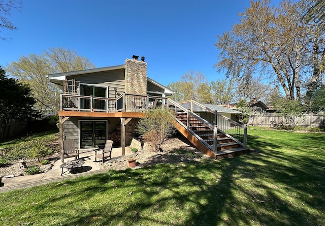 2241 17th St NW, New Brighton, MN 55112 - rear view of house featuring a chimney, a patio area, stairway, and a deck