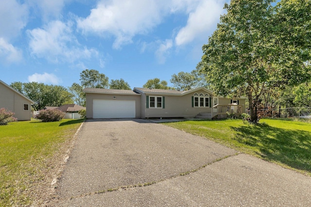 3209 3rd Ave NW, Willmar, MN 56201 - single story home with driveway, a garage, and a front yard