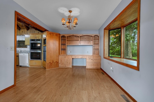 13047 Endicott Dr NW, Clearwater, MN 55320 - kitchen with stainless steel double oven, white dishwasher, light wood finished floors, a chandelier, and baseboards