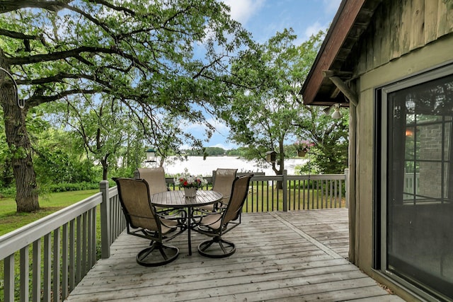 13047 Endicott Dr NW, Clearwater, MN 55320 - wooden terrace with outdoor dining area and a water view