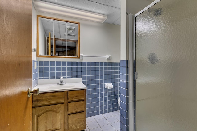 13047 Endicott Dr NW, Clearwater, MN 55320 - bathroom with tile walls, vanity, a shower stall, toilet, and tile patterned floors