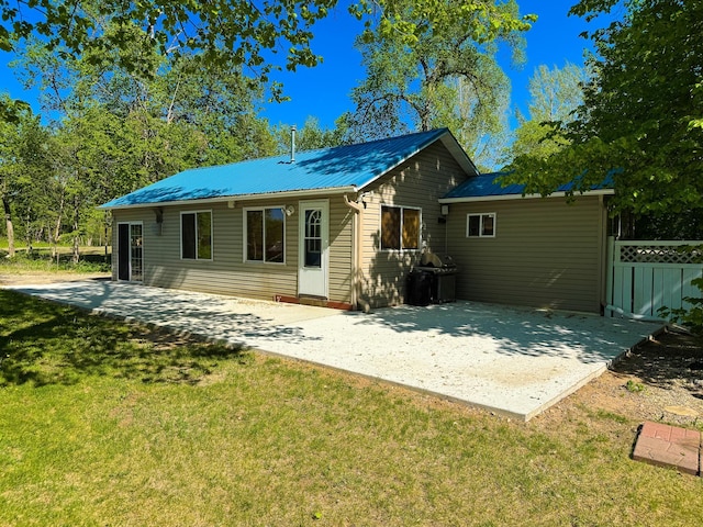 41443 County Highway 1, Ottertail, MN 56571 - rear view of property with a patio and metal roof