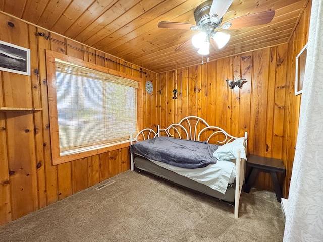 41443 County Highway 1, Ottertail, MN 56571 - bedroom featuring wood walls, carpet flooring, wooden ceiling, and ceiling fan