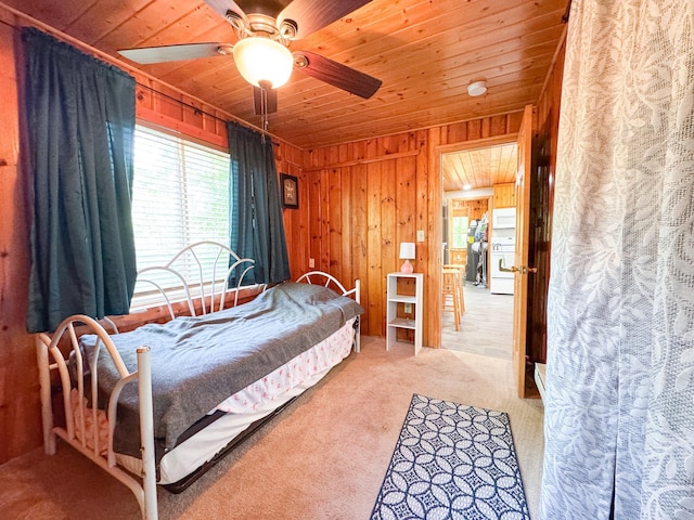 41443 County Highway 1, Ottertail, MN 56571 - bedroom featuring multiple windows, wooden ceiling, wooden walls, carpet floors, and ceiling fan