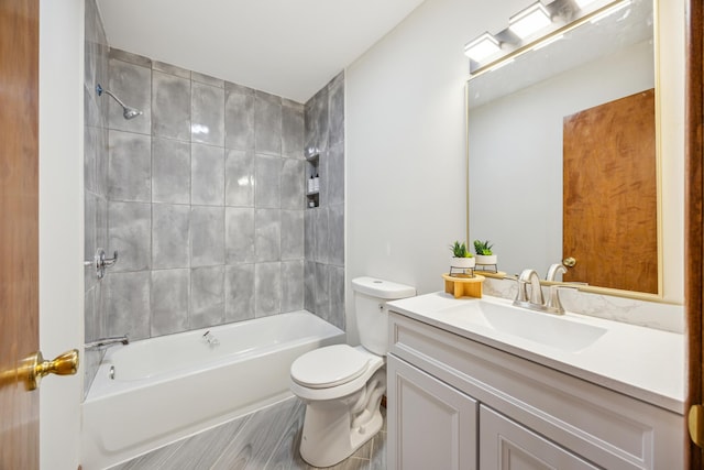 bathroom with toilet, bathing tub / shower combination, vanity, and wood finished floors