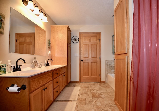 11375 Gem St, Milaca, MN 56353 - full bath featuring stone finish flooring, a bath, double vanity, and baseboards