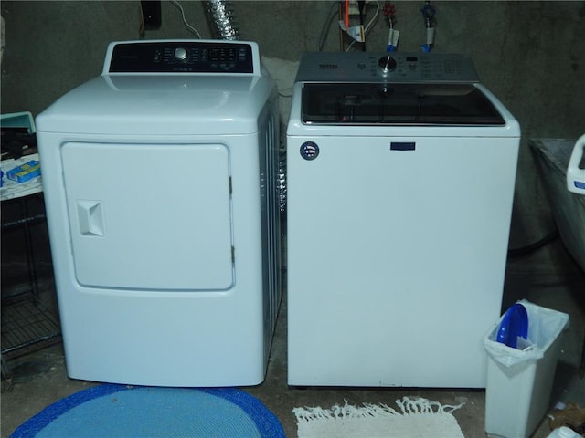 laundry area with independent washer and dryer