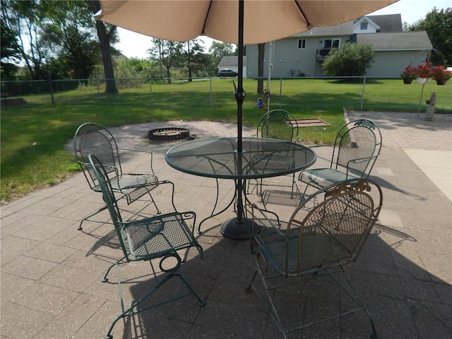 view of patio featuring a fire pit and outdoor dining area
