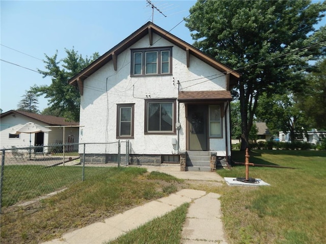 view of front of house featuring entry steps and stucco siding