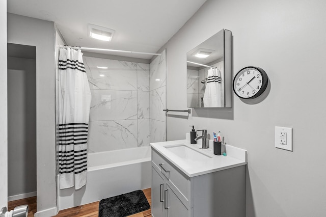 1200 3rd St NE, Minneapolis, MN 55413 - bathroom featuring wood finished floors, vanity, and shower / bath combination with curtain