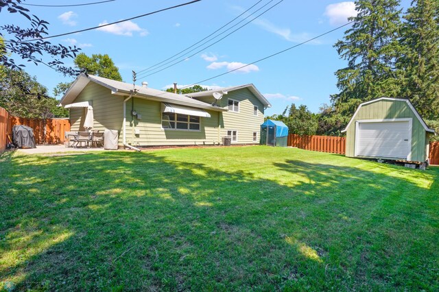2807 Edgewood Dr N, Fargo, ND 58102 - view of yard featuring a shed, an outbuilding, and a patio area
