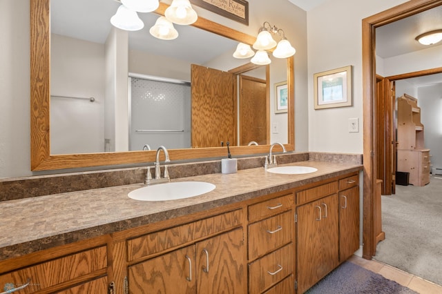 2807 Edgewood Dr N, Fargo, ND 58102 - full bathroom with double vanity, a chandelier, and tile patterned flooring