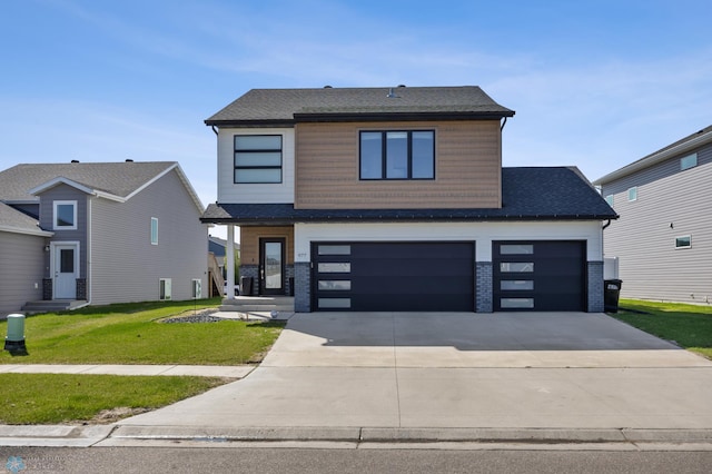977 Ashley Dr W, West Fargo, ND 58078 - contemporary house featuring driveway, a front yard, entry steps, a shingled roof, and an attached garage
