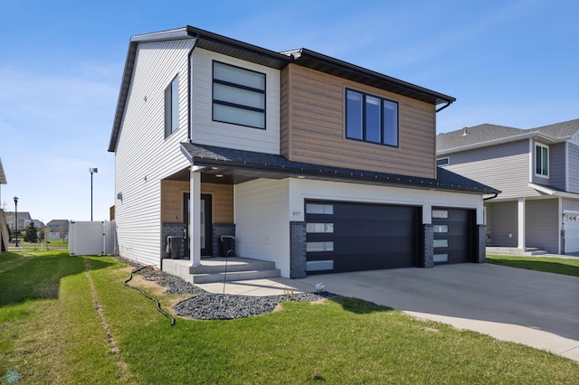 977 Ashley Dr W, West Fargo, ND 58078 - contemporary home with a garage and concrete driveway