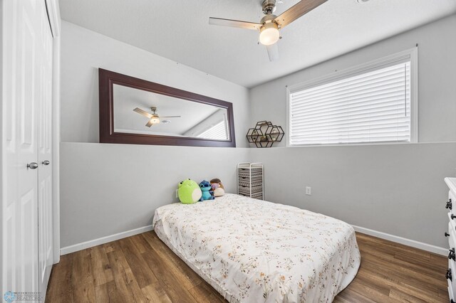 977 Ashley Dr W, West Fargo, ND 58078 - bedroom featuring wood finished floors, baseboards, and a ceiling fan