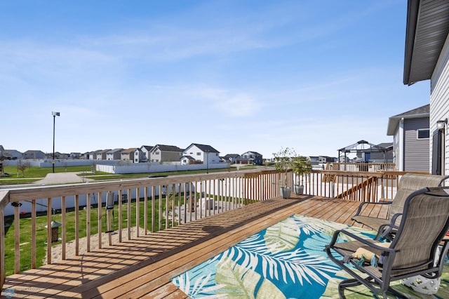 977 Ashley Dr W, West Fargo, ND 58078 - deck with a residential view and a lawn