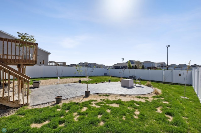 977 Ashley Dr W, West Fargo, ND 58078 - view of yard featuring a patio, a residential view, a deck, and stairs