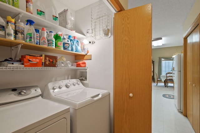 19136 Concord Ct NW, Elk River, MN 55330 - laundry room featuring washer and clothes dryer and light floors