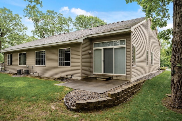 19136 Concord Ct NW, Elk River, MN 55330 - rear view of property with a lawn, a patio, central AC unit, and roof with shingles