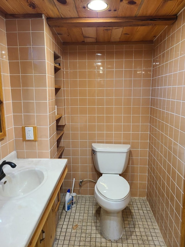 103 4th St, Grand Rapids, MN 55744 - bathroom featuring tile walls, toilet, wood ceiling, vanity, and tile patterned floors