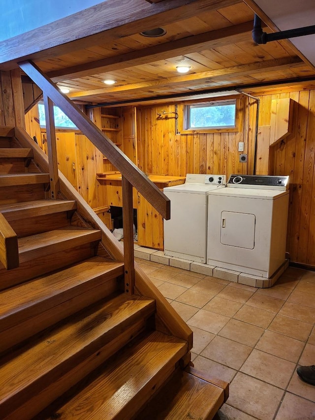 103 4th St, Grand Rapids, MN 55744 - stairway with wooden walls, wood ceiling, washer and dryer, and tile patterned flooring
