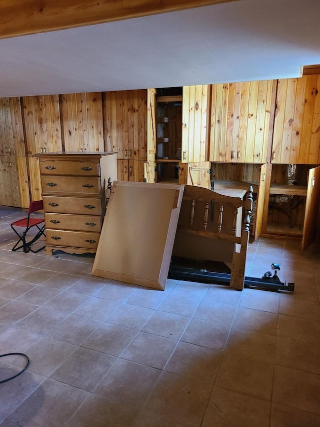 103 4th St, Grand Rapids, MN 55744 - tiled dining space featuring wood walls