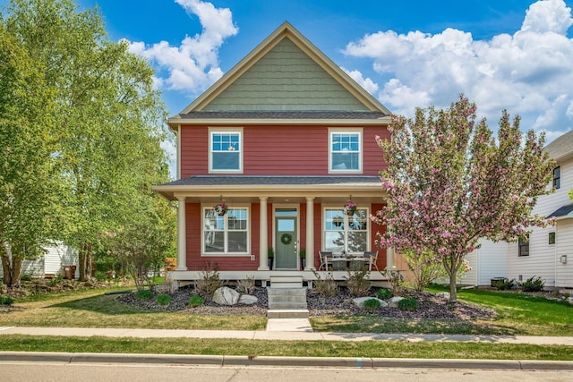1013 Planters Path, Bayport, MN 55003 - american foursquare style home with a porch, a front yard, and roof with shingles