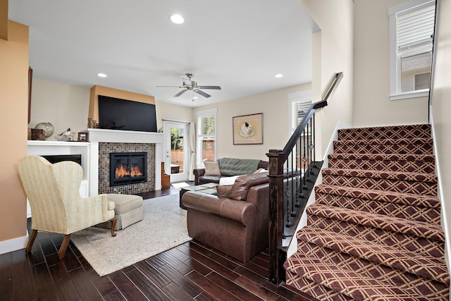 1013 Planters Path, Bayport, MN 55003 - living room featuring wood finished floors, ceiling fan, a tiled fireplace, recessed lighting, and stairway