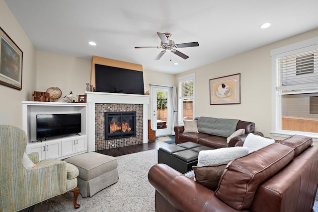 1013 Planters Path, Bayport, MN 55003 - living room featuring ceiling fan, a tiled fireplace, recessed lighting, and wood finished floors