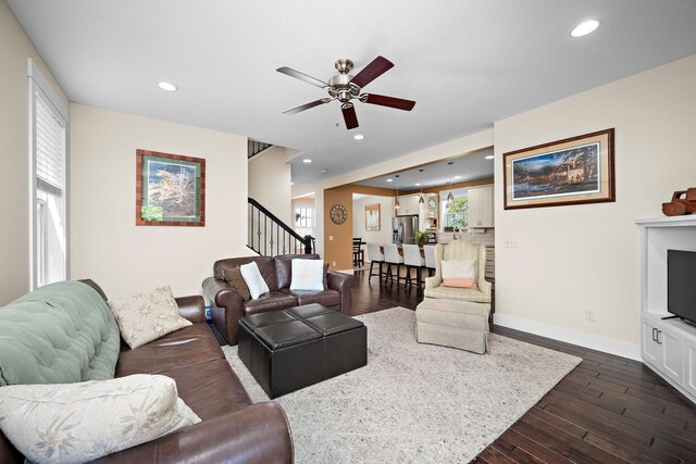 1013 Planters Path, Bayport, MN 55003 - living room with ceiling fan, stairs, recessed lighting, dark wood finished floors, and baseboards