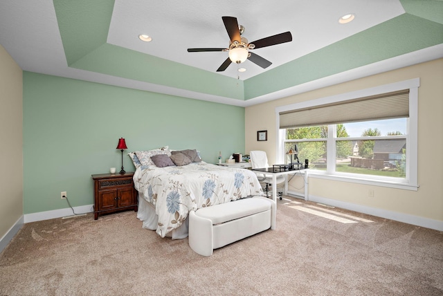 1013 Planters Path, Bayport, MN 55003 - carpeted bedroom with baseboards, a tray ceiling, ceiling fan, recessed lighting, and an office area