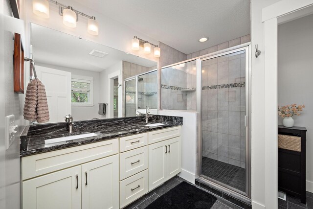 1013 Planters Path, Bayport, MN 55003 - bathroom with a shower stall, double vanity, and recessed lighting