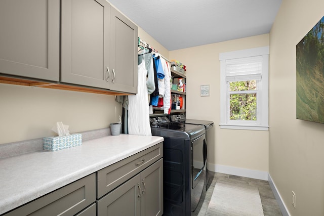 1013 Planters Path, Bayport, MN 55003 - clothes washing area featuring cabinet space, separate washer and dryer, and baseboards