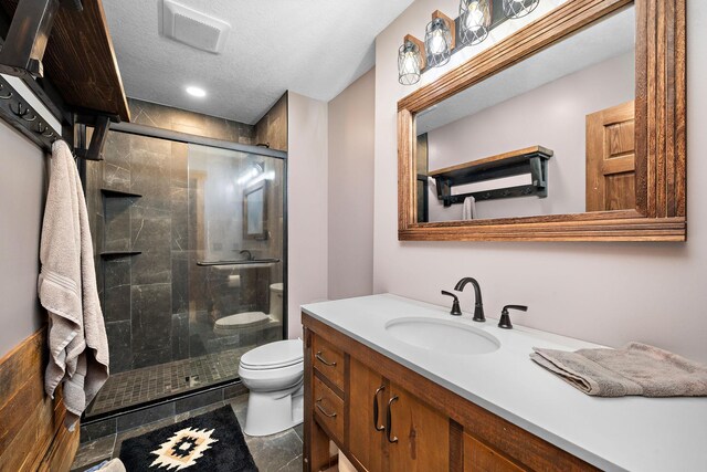 1013 Planters Path, Bayport, MN 55003 - bathroom featuring toilet, a shower stall, vanity, and a textured ceiling
