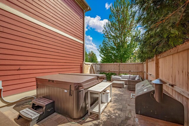1013 Planters Path, Bayport, MN 55003 - view of patio with a hot tub, a fenced backyard, an outdoor living space, and a grill