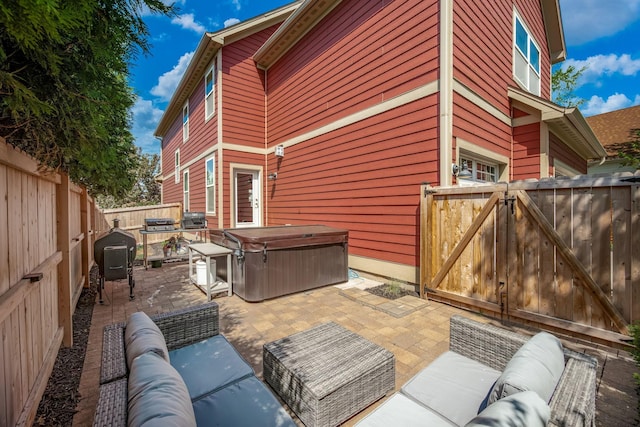 1013 Planters Path, Bayport, MN 55003 - view of patio featuring a hot tub, a fenced backyard, an outdoor hangout area, a gate, and grilling area