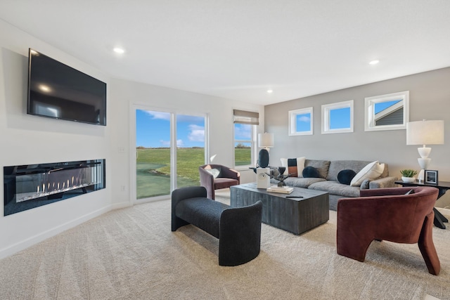 1951 Fulton Rd, Carver, MN 55315 - living area with carpet floors, a glass covered fireplace, recessed lighting, and baseboards