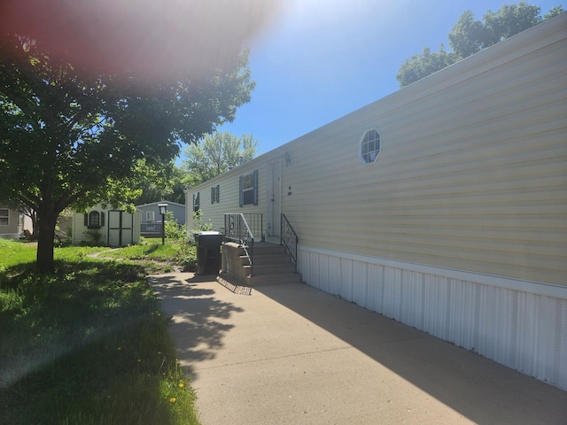 102 Jaybee Ln, Mankato, MN 56001 - view of property exterior featuring a shed and an outbuilding