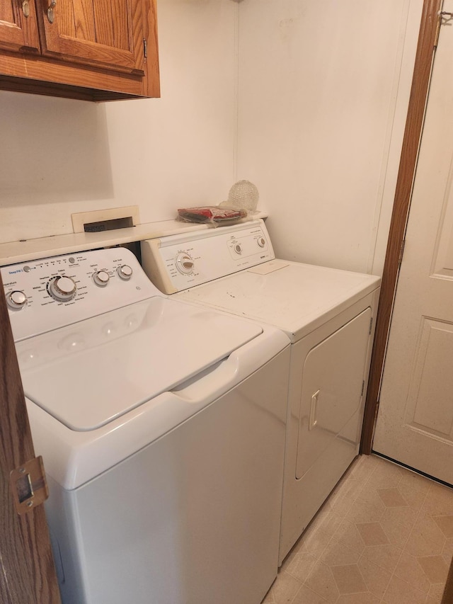 102 Jaybee Ln, Mankato, MN 56001 - laundry area with cabinet space and washing machine and dryer