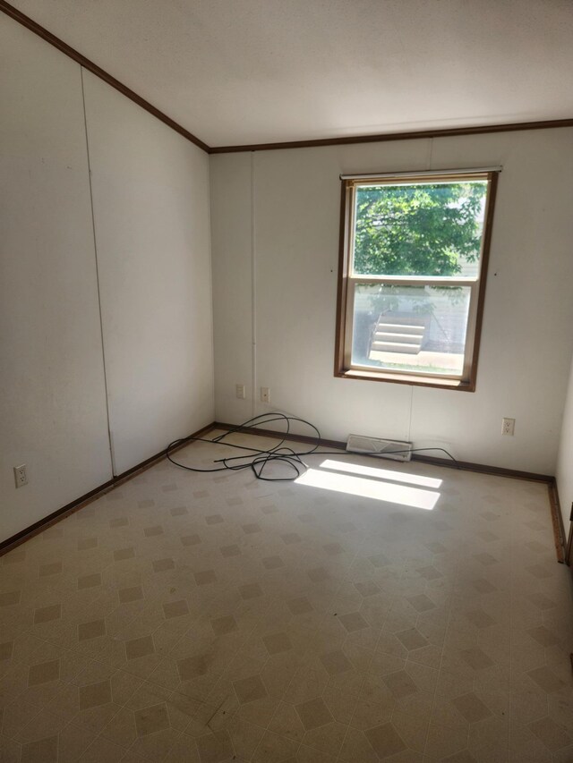 102 Jaybee Ln, Mankato, MN 56001 - empty room with baseboards and crown molding