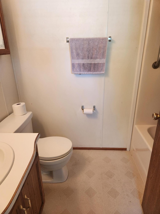 102 Jaybee Ln, Mankato, MN 56001 - full bath featuring toilet, tile patterned floors, vanity, and baseboards