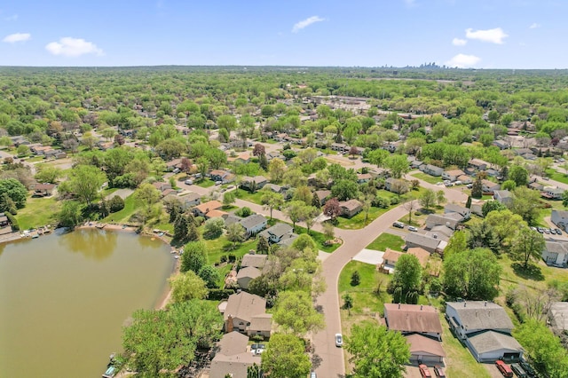 aerial view of residential area with a large body of water