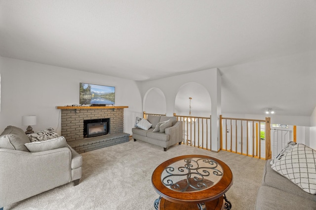 carpeted living area featuring a fireplace and plenty of natural light
